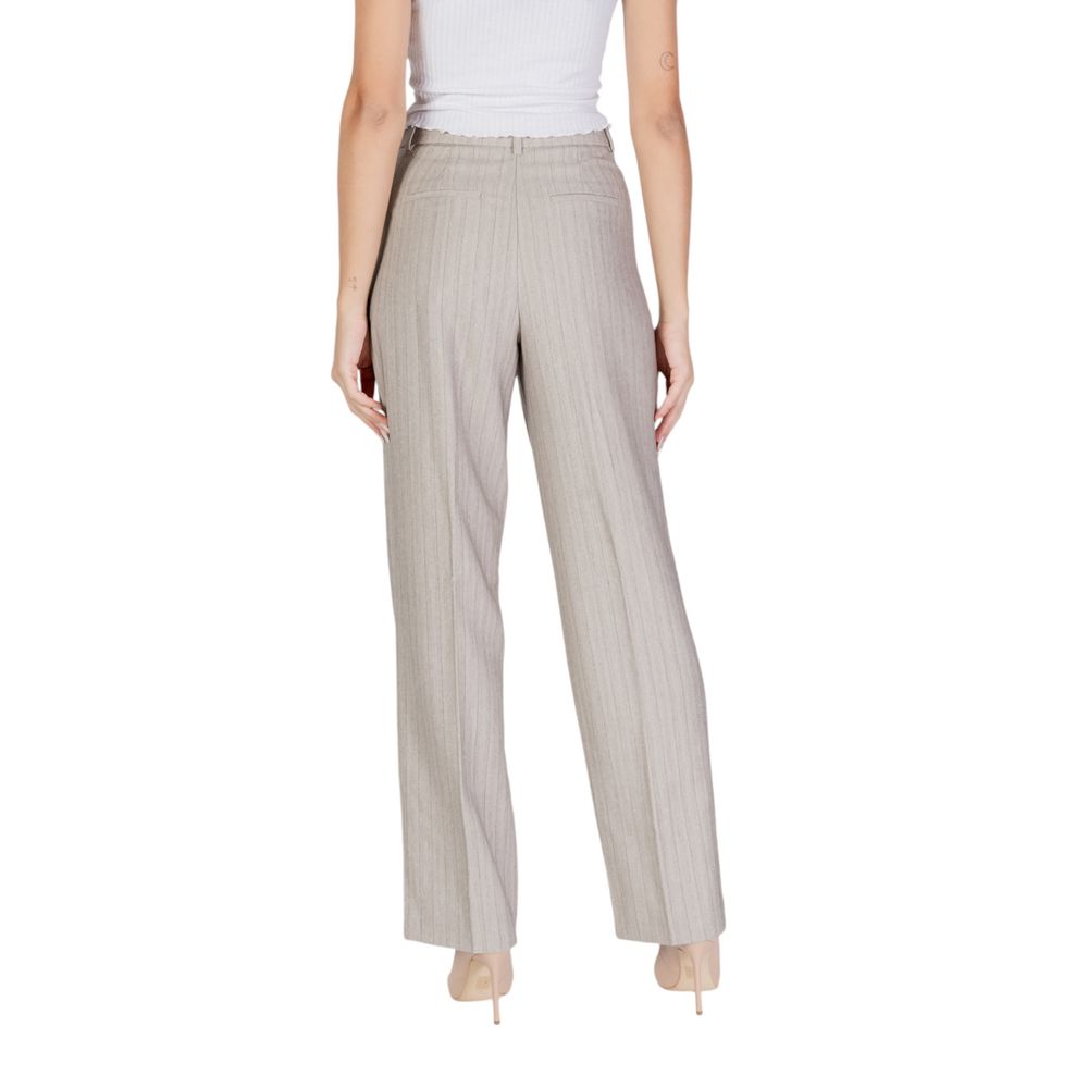 Back view of a woman wearing Vero Moda Gray Polyester Casual Pants with herringbone pattern and wide-leg cut.