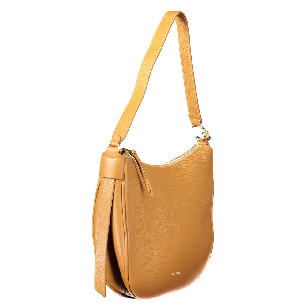 Coccinelle Brown Leather Handbag with shoulder handle, zip closure, internal pocket, and phone spaces, featuring logo.