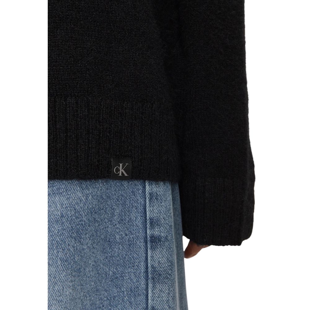 Close-up of Calvin Klein Jeans Black Polyester Sweatshirt sleeve, featuring a wool blend for a textured and relaxed look.