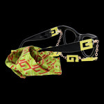Alt Tag: Stylish GUESS MOD. GU2988 50041 black ladies' glasses with green patterned cleaning cloth and gold chain accents.