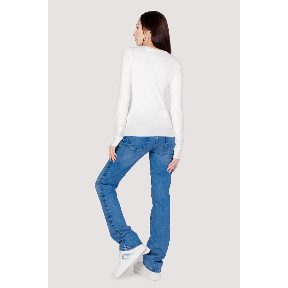 Back view of woman wearing Guess White Cotton Sweatshirt with jeans, showing modern V-neck and button-accented sleeves.