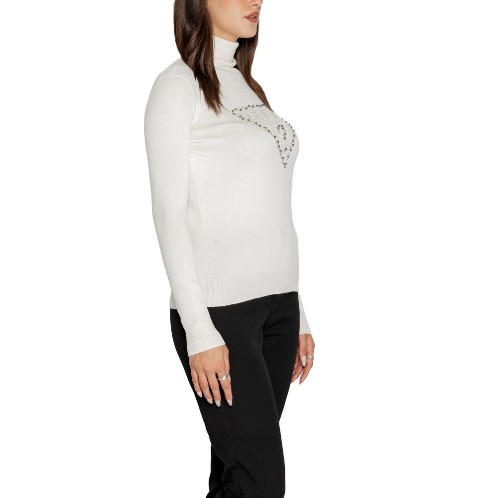 Woman wearing Guess White Viscose Turtleneck with triangle design, side view. Stylish knitwear for a contemporary look.