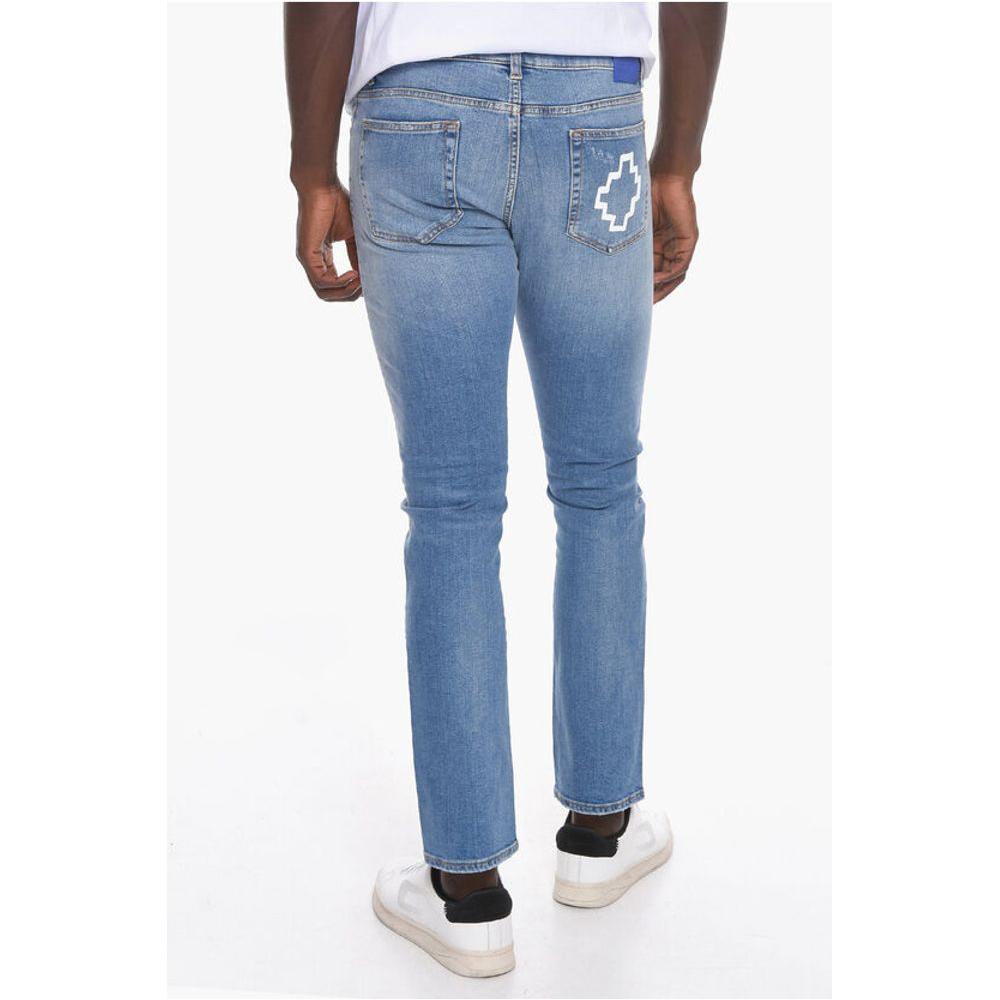Marcelo Burlon Belt Loop TEMPERA CROSS Slim Fit Denims 17cmDescription: Details: STREET CHIC Autumn-Winter Light blue Light wash Buttons Denim cotton Belt loops Logo Print Made in Italy Straight-cut leg Casual Denim Rules P535155 Ankle 17cm