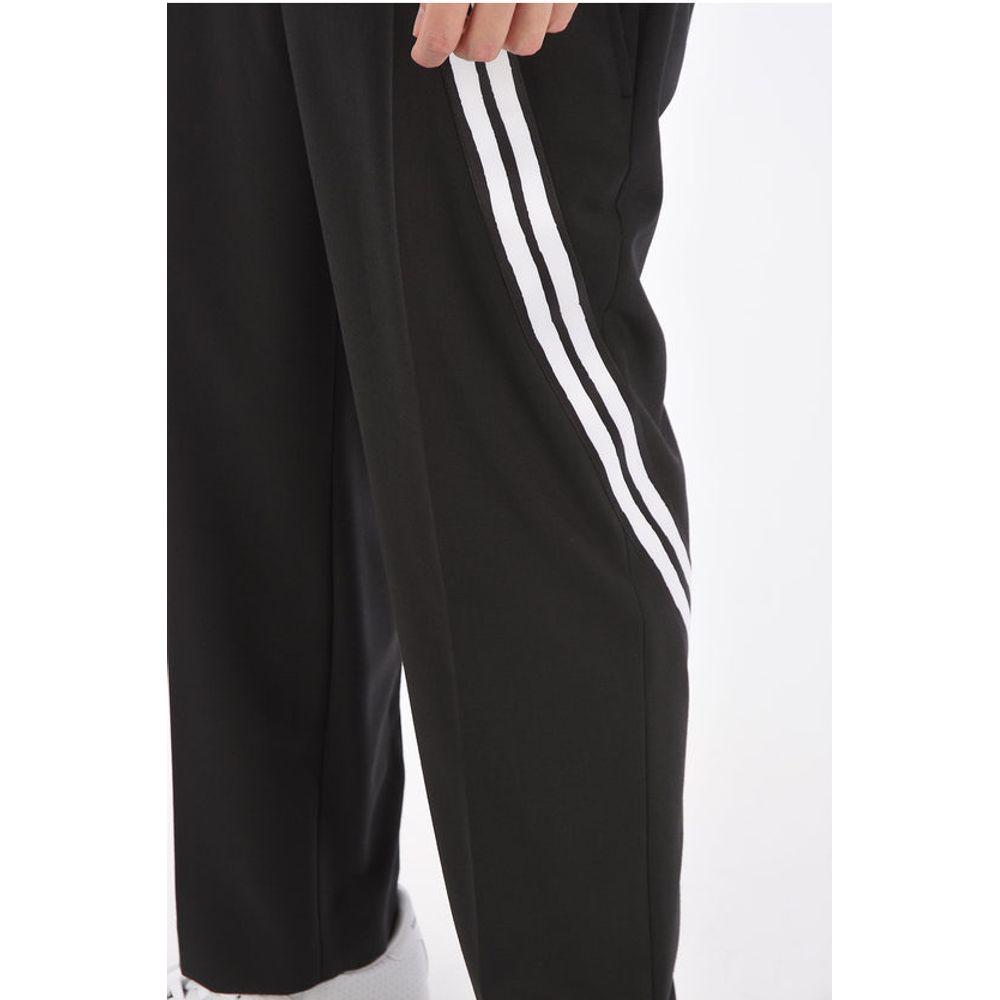 Neil Barrett Mid-rise waist slim fit pantsDescription: Details: Spring-Summer Black Buttons Zip closure Belt loops Pockets Contrasting stripe Front closure Hidden closure Normal waisted Made in Italy Jetted pocket Zip closure pocket Pockets with Buttons P