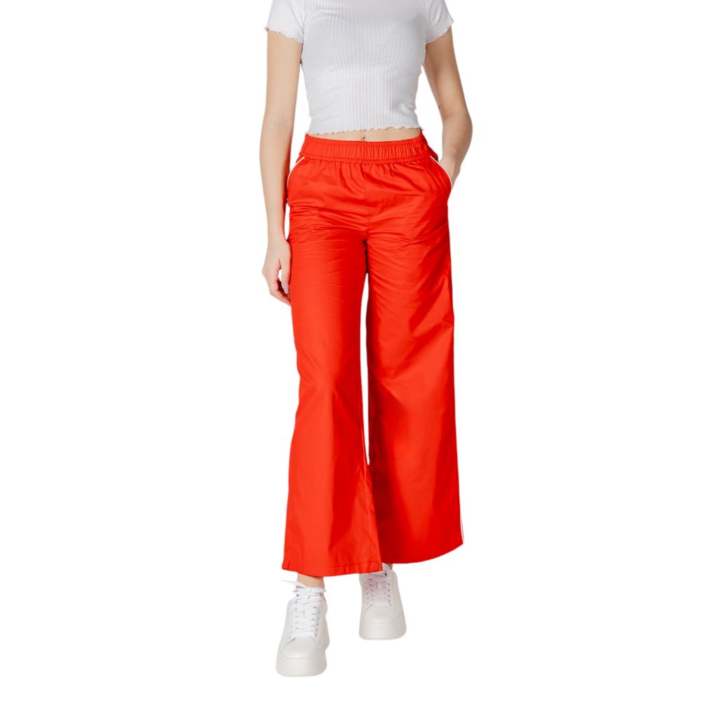 Only Red Cotton Casual Pants with elastic waistband and piping detail, worn by model with white top and sneakers. Ideal for spring and summer.