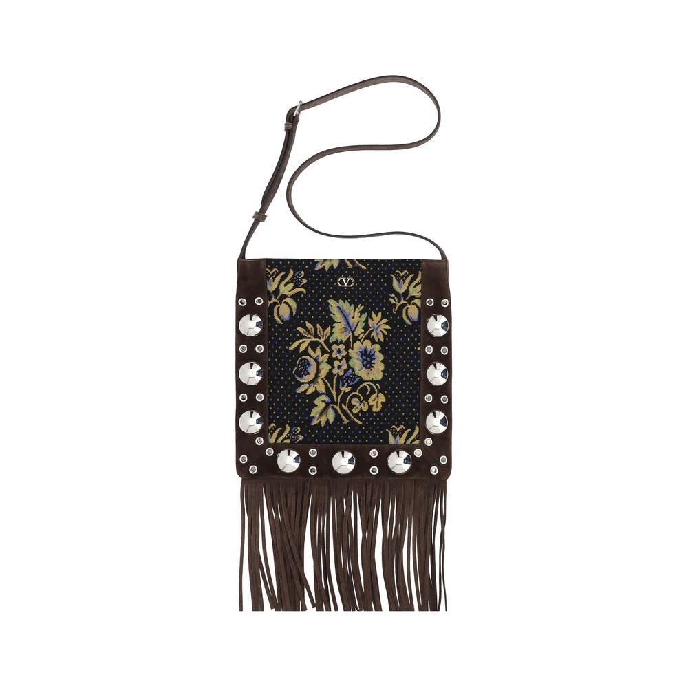 Valentino Garavani Fringe Shoulder BagThe Valentino Garavani Leather Shoulder Bag combines elegance and character. The adjustable shoulder strap ensures comfort, while the zippered closure protects the items inside. The iconic logo plaque applied to the f