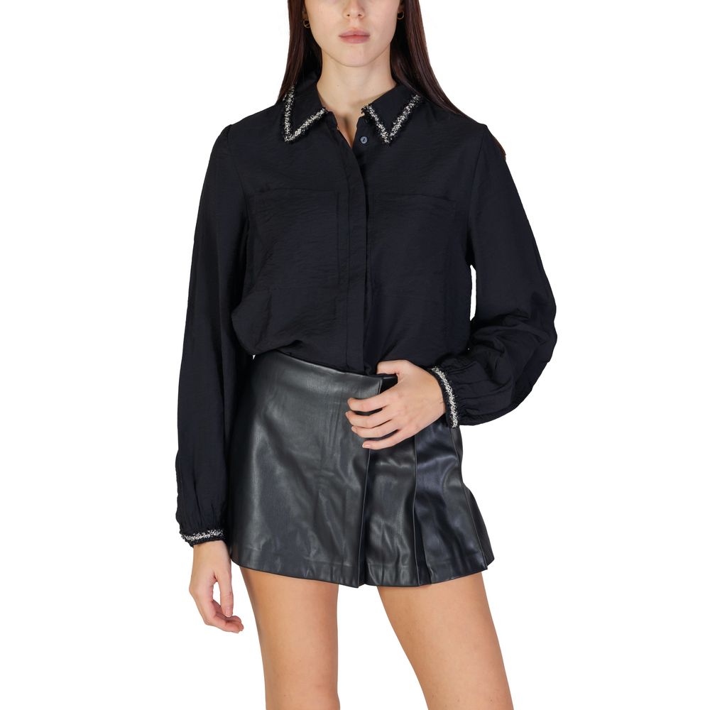 Woman wearing Vila Clothes Black Viscose Blouse with braided collar and elasticated cuffs, styled elegantly with black leather skirt.