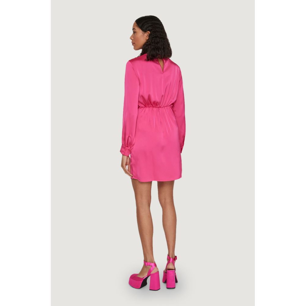 Model wearing Vila Clothes Pink Polyester Short Dress with long sleeves and waist knot detail, viewed from the back.