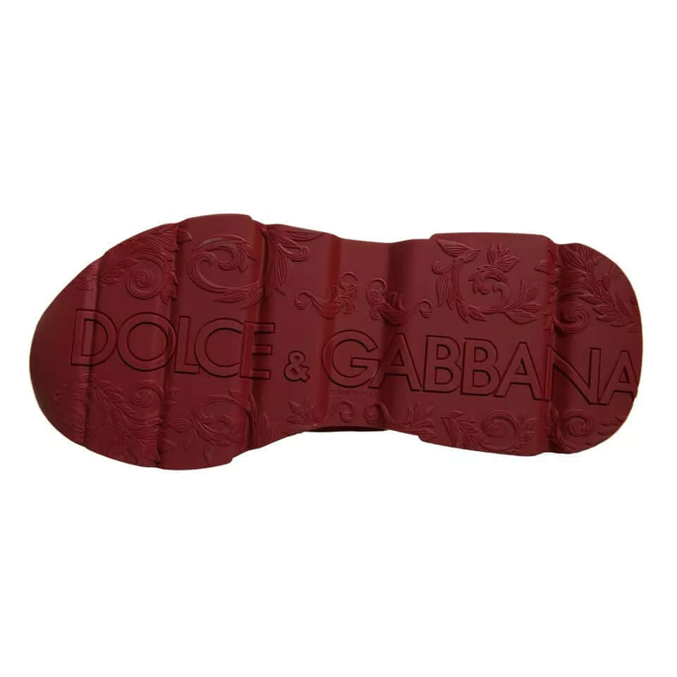 Dolce & Gabbana red leather sneaker sole featuring embossed logo for stylish footwear design.