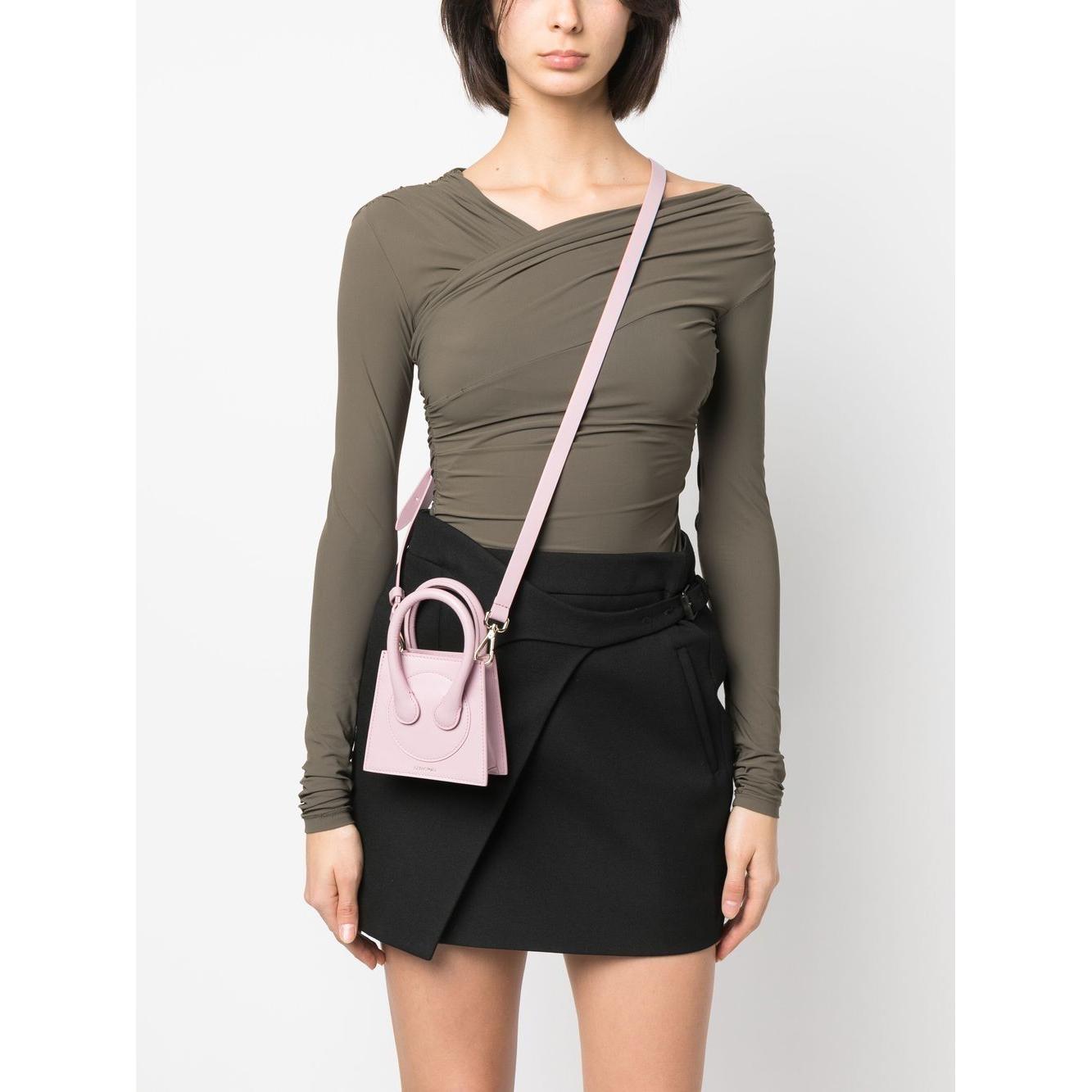 Front view with bag zipped and handles upright.