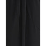 Close-up of black JACQUEMUS Skirts with high waist, front slit, pleat detail, and rear zip fastening.