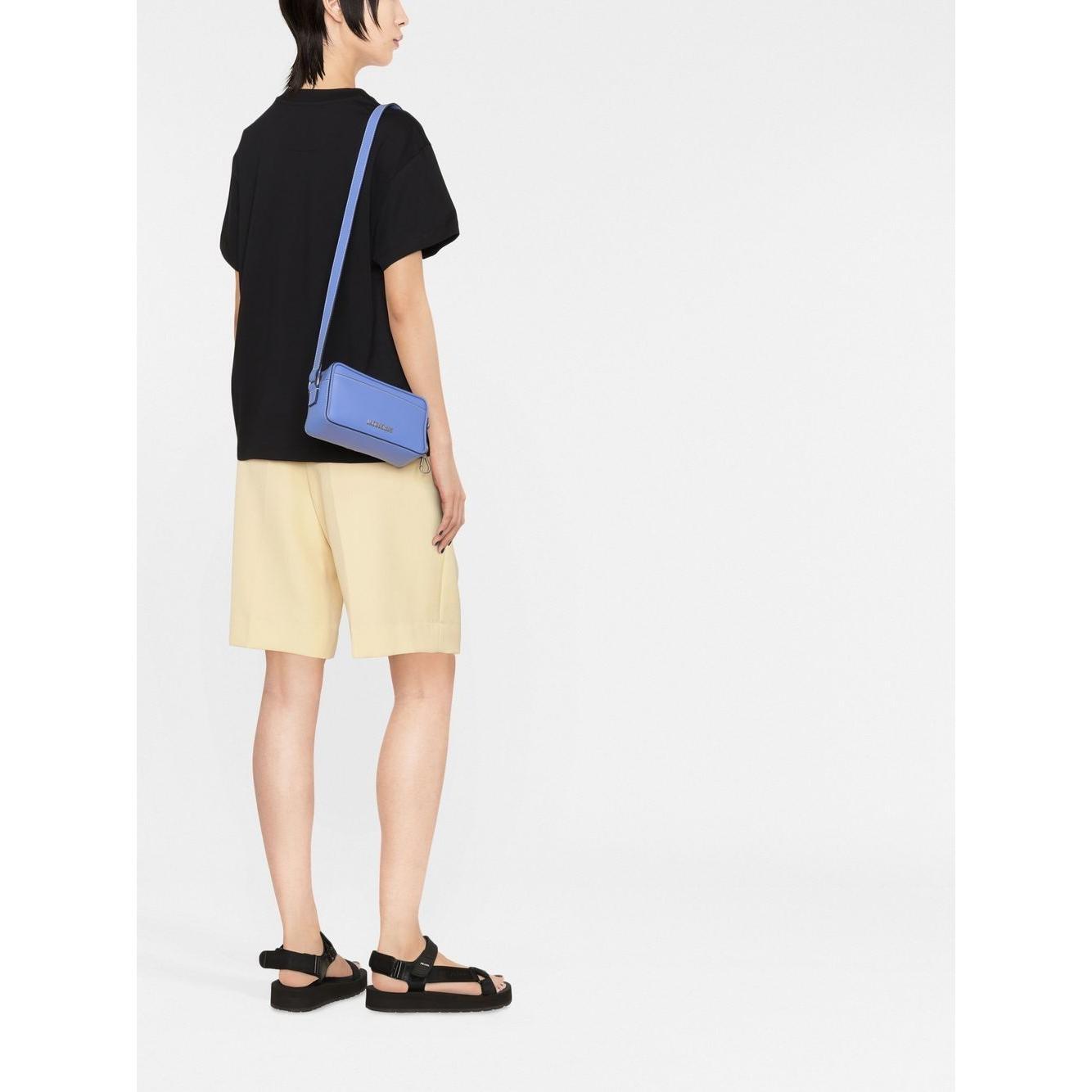 Front view with bag zipped and handles upright.