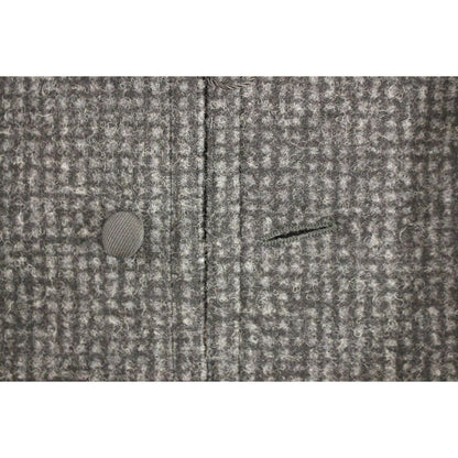 Dolce Gabbana gray wool vest close-up showing button and fabric texture.