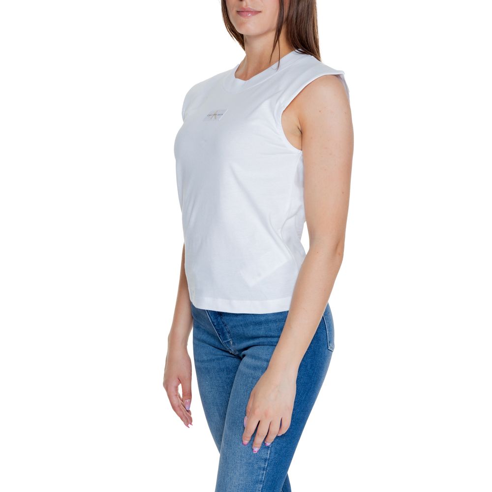 Woman wearing Calvin Klein Jeans White Cotton T-Shirt with loose silhouette and sleeveless design, showcasing casual elegance.