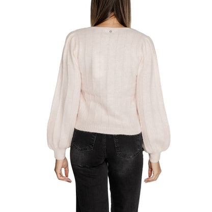 Back view of woman wearing Guess Pink Polyester Sweatshirt with ribbed texture and long sleeves