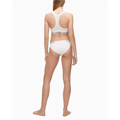 Calvin Klein Underwear White Cotton Pantie worn by model, showing minimalist design with logo on waistband, back view.