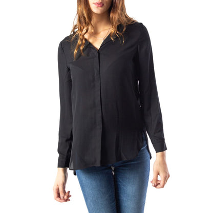 Woman wearing a Vila Clothes Black Polyester Blouse with long sleeves and classic collar.