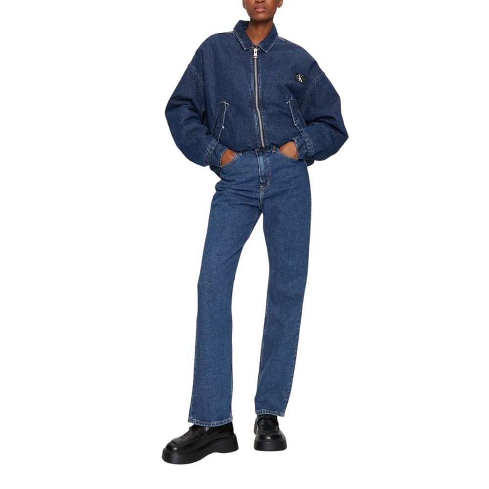 Person wearing Calvin Klein Jeans Blue Cotton Mom Jeans with a high-rise, straight cut, styled for a modern look with a denim jacket.