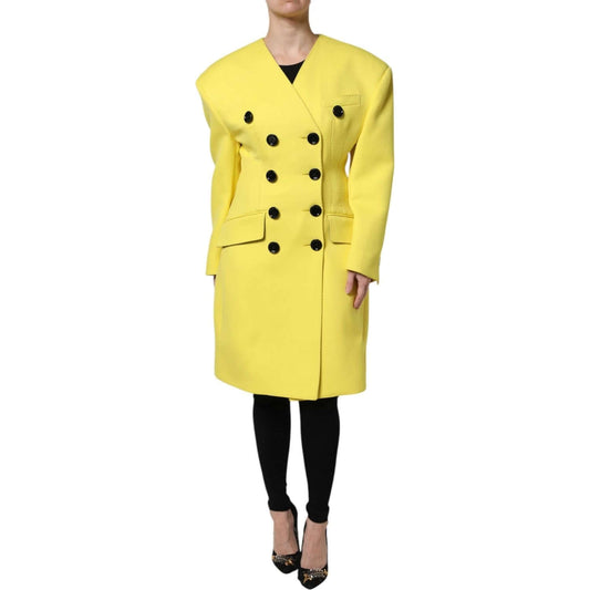 Dolce & Gabbana yellow double breasted trench coat jacket made of 100% virgin wool with button closure and logo details, modelled front view.