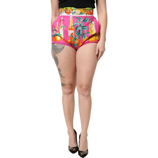 Dolce & Gabbana pink high waist hot pants shorts with vibrant fruit print, 100% cotton, worn by model, showcasing exclusive Italian craftsmanship.