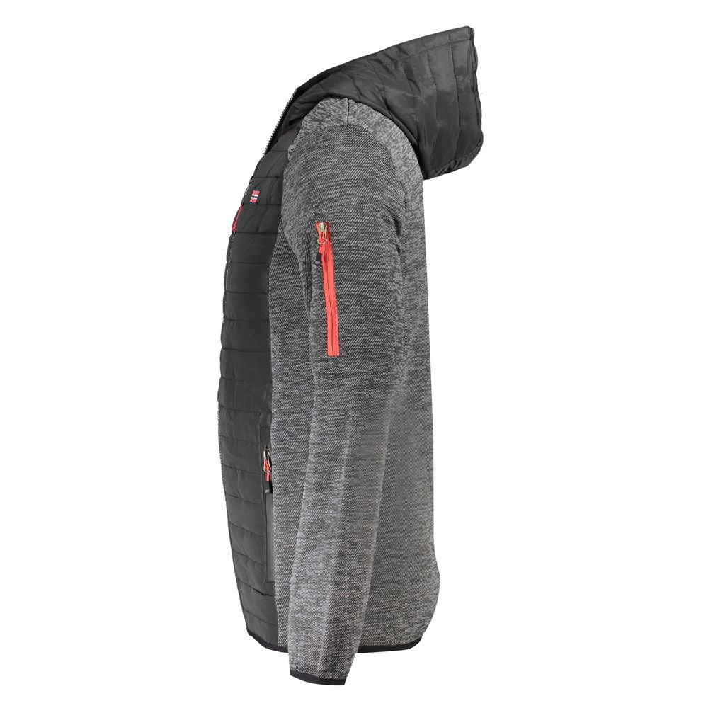 Front view with bag zipped and handles upright.