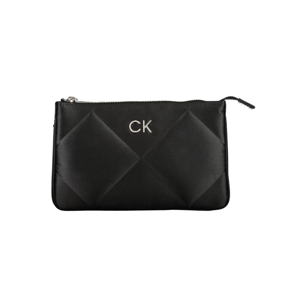 Calvin Klein Black Polyester Handbag with adjustable strap, two compartments, and zip closure, featuring contrasting details and internal card pocket.