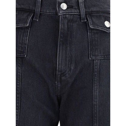 Close-up of 7FOR Black Cotton Jeans Denim showing high-waisted design and gold-trimmed flap pockets with front seam detail.