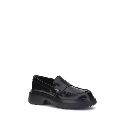 Tod's Black Rubber Platform Loafers with patent leather and rounded toe, featuring a side logo plaque for an elegant design.