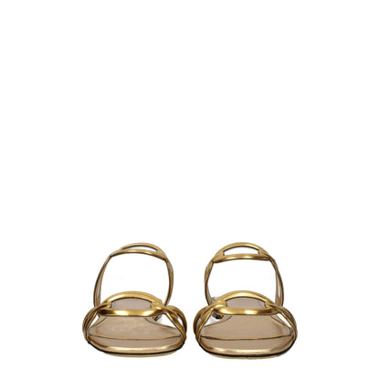 Valentino Garavani Gold Leather Slippers with open toe and low flat heel, featuring a casual design perfect for stylish comfort.