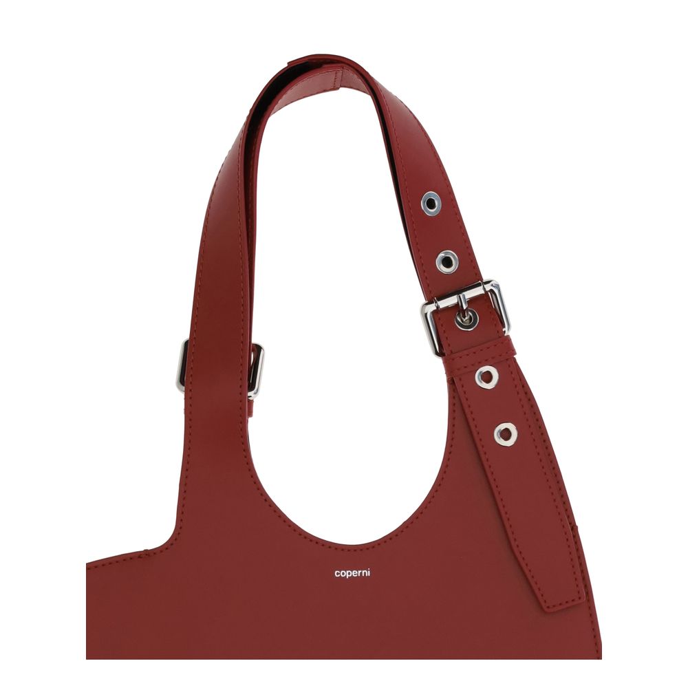 Coperni Bordeaux Calf Leather Bos Taurus Shoulder Bag with belted handle, made of smooth red leather, AW25 collection, Italian craftsmanship.