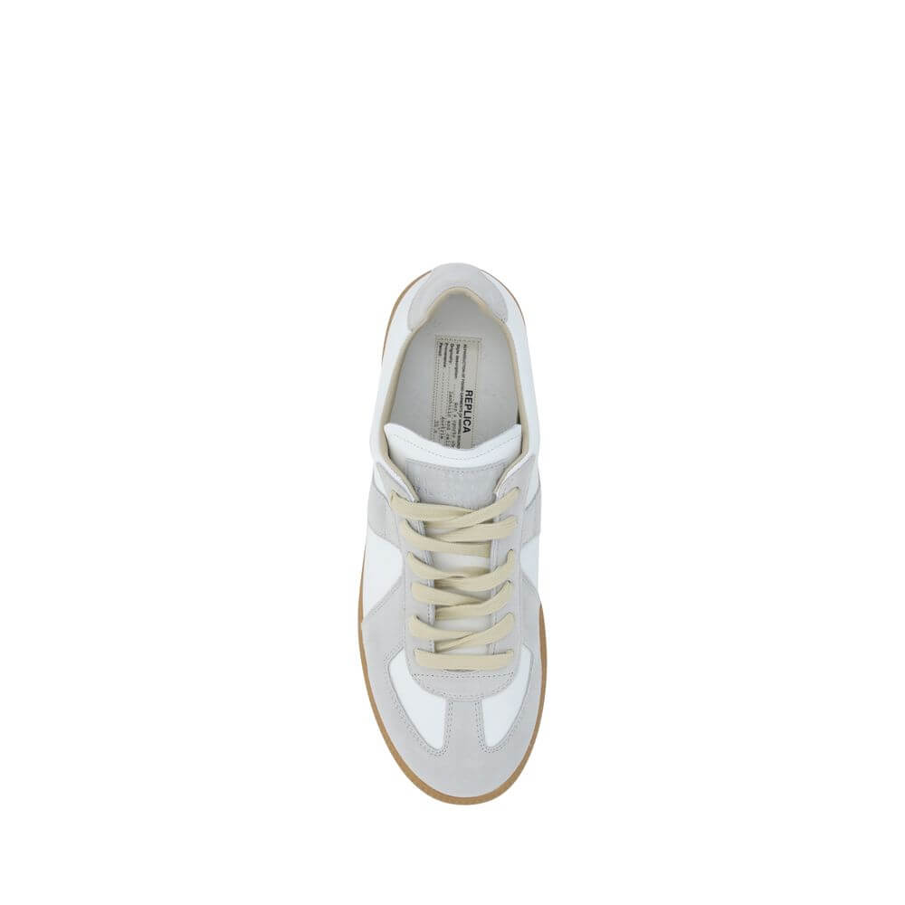 Top view of Margiela White Rubber Low Top Sneakers with suede detailing and contrasting gum sole, featuring a front logoed press-stud tab.