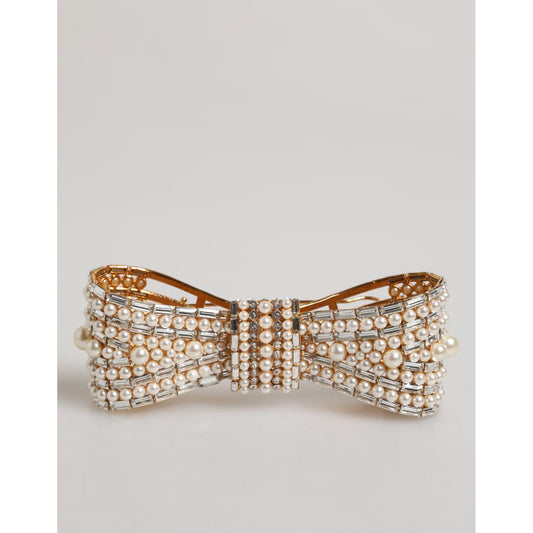 Dolce & Gabbana Gold Tone Brass Bow Crystal FauxPearl Embellished Brooch with logo details on white background.