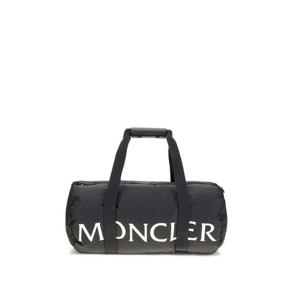 Moncler Black Nylon Luggage And Travel duffle bag with logo, leather-tab handles, detachable strap, and stylish design.