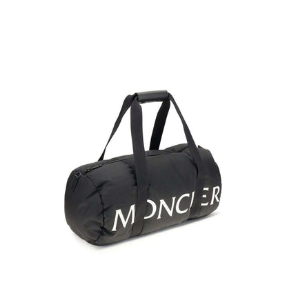 Moncler Black Nylon Luggage And Travel duffle bag with logo, leather-tab handles, adjustable shoulder strap, and zip closure.