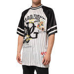 Man wearing Dolce & Gabbana Tradizione Graffiti Print Oversized Men T-shirt, showcasing pinstripe pattern and artistic graffiti graphics.