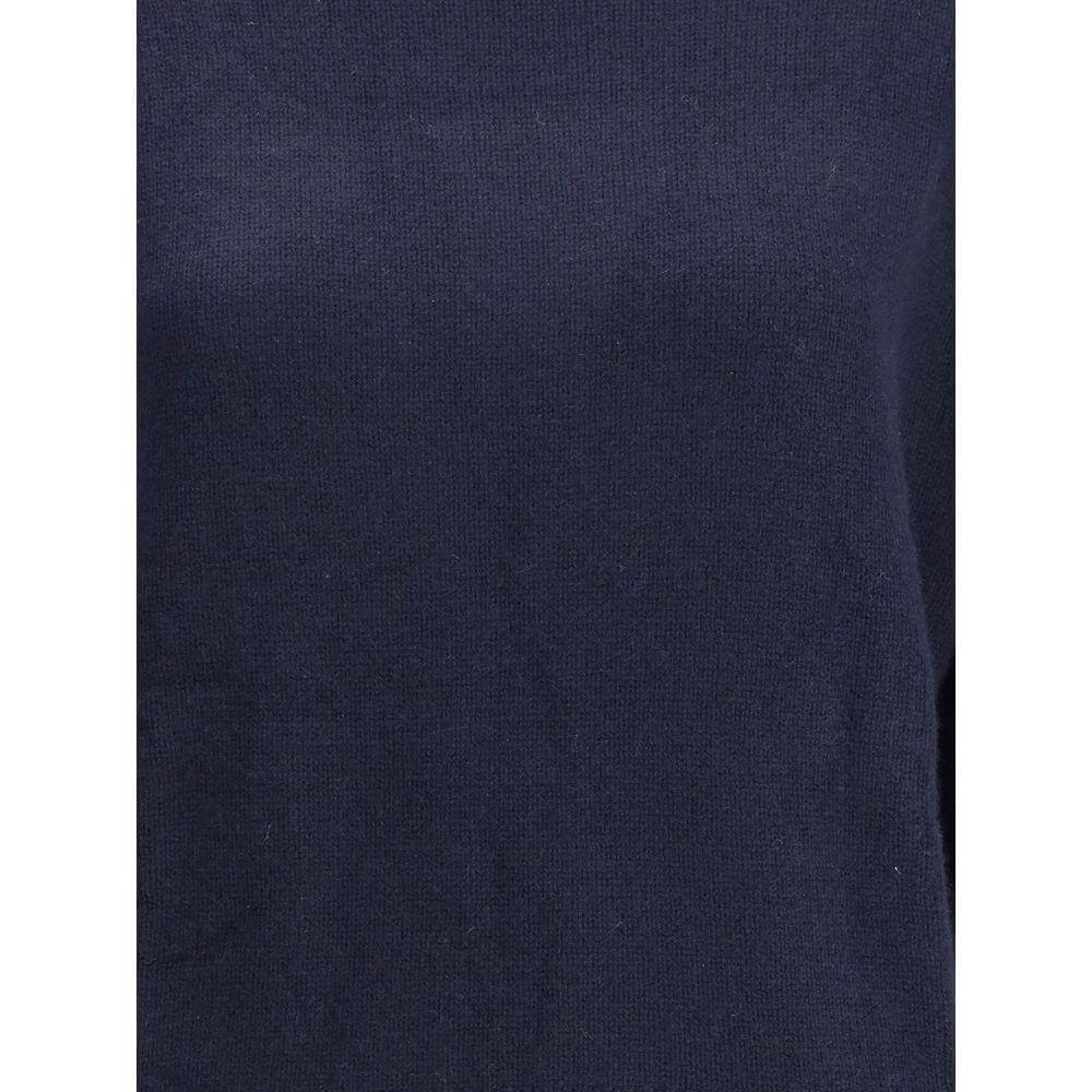 Close-up of Allude Turtleneck Sweater in navy cashmere, showcasing soft texture and elegant design perfect for cold seasons.