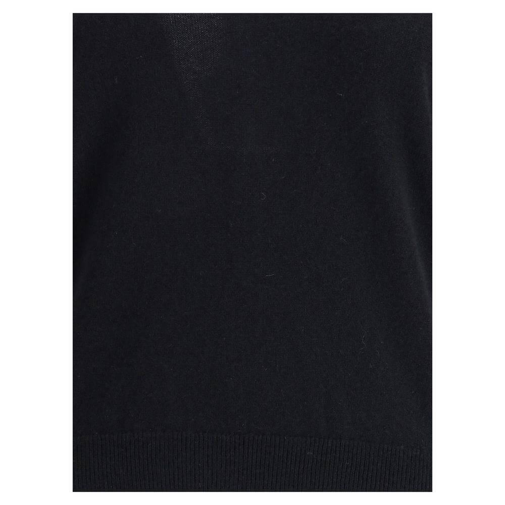 Close-up of Allude Cashmere Sweater showing ribbed hem detail, crafted from 100% Kashmir for refined comfort in a classic black shade.