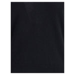 Close-up of Allude Cashmere Sweater showing ribbed hem detail, crafted from 100% Kashmir for refined comfort in a classic black shade.