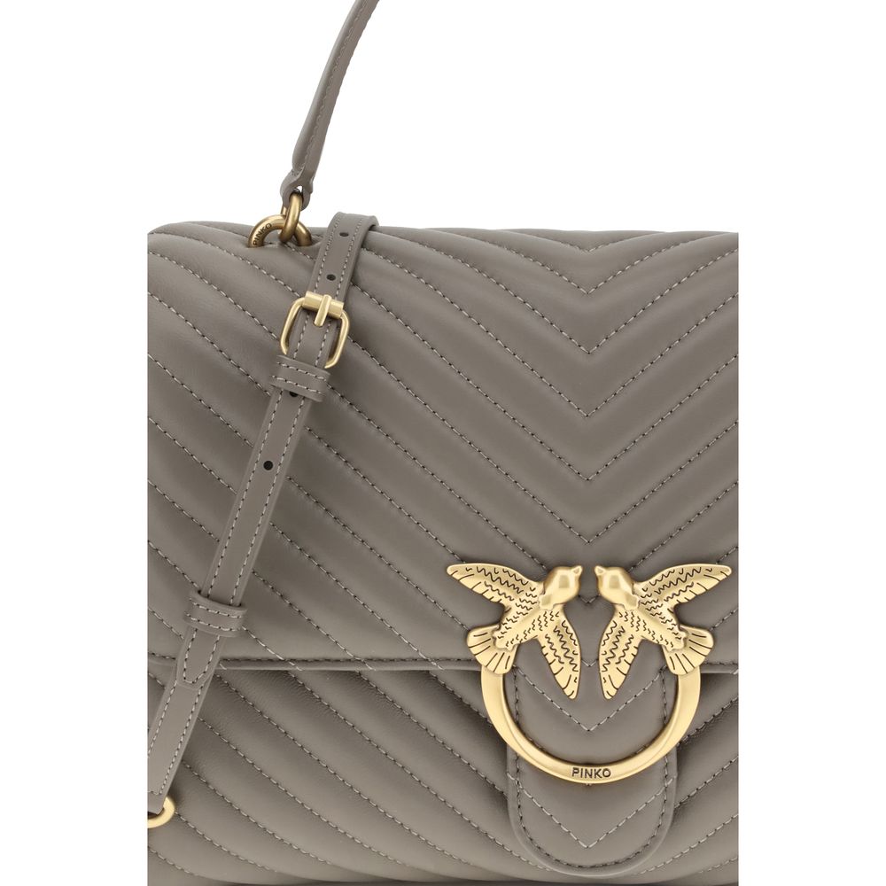 Front view with bag zipped and handles upright.