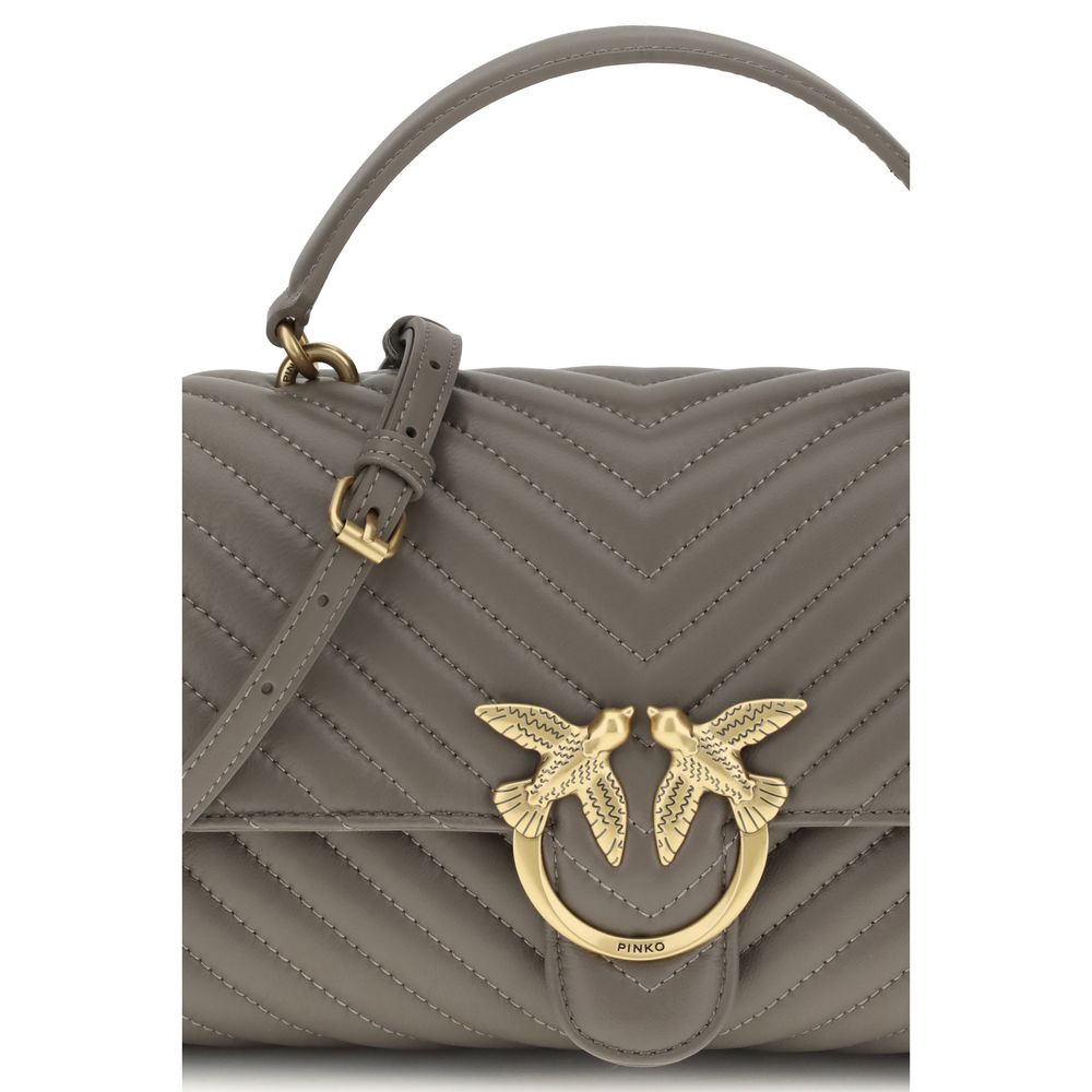 Front view with bag zipped and handles upright.