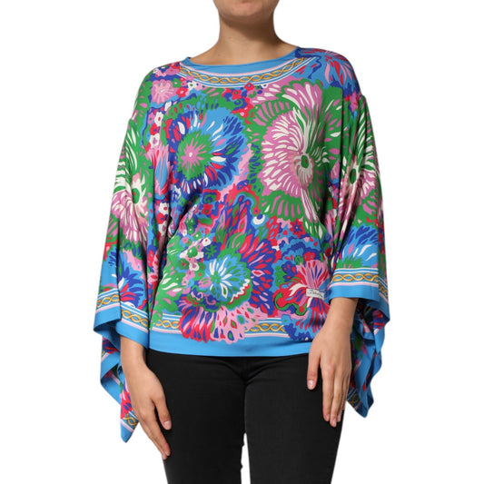 Model wearing Dolce & Gabbana Multicolor Floral Printed Tunic Blouse Top with vibrant floral design and relaxed fit
