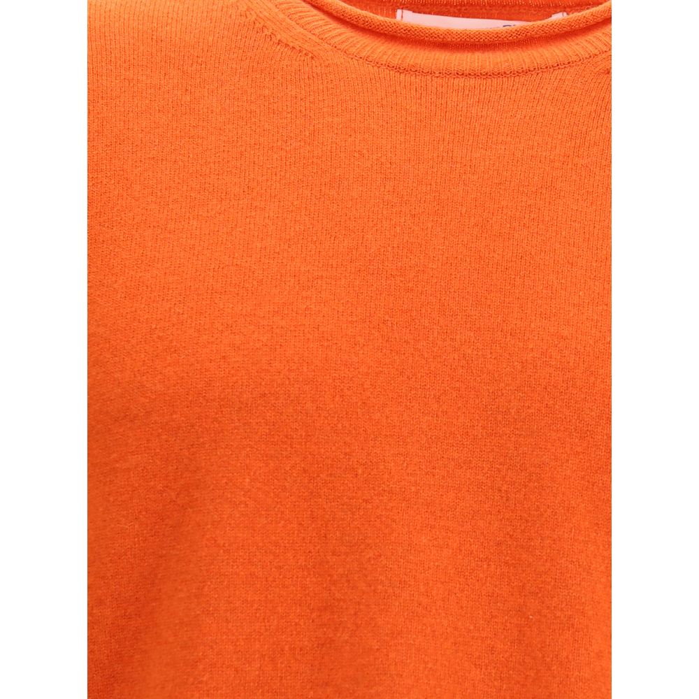 Comme Des Garçons Orange Wool Sweatshirt, ribbed knit, round neckline, long sleeves, Autumn-Winter fashion, sophisticated elegance.
