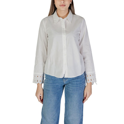 Jacqueline De Yong White Cotton Blouse with cut-out cuff detail and button closure, ideal for office wear, styled with blue jeans.