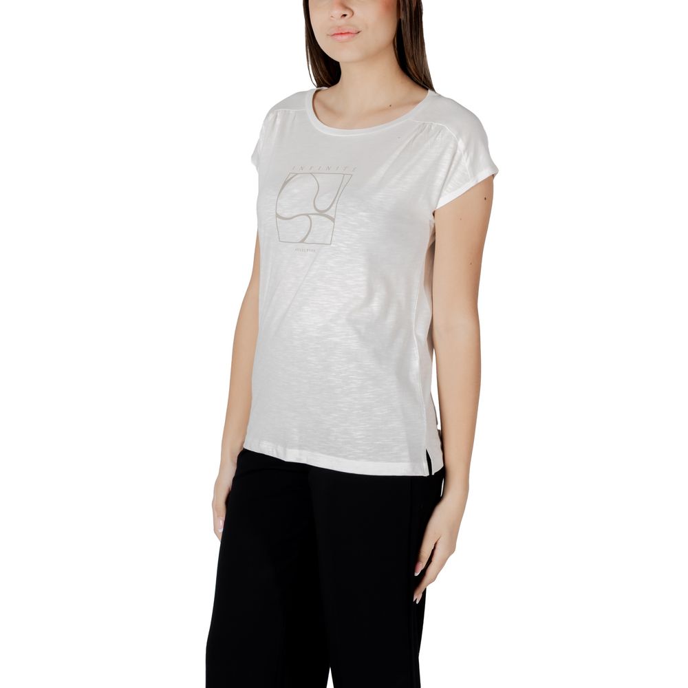 Woman wearing Street One White Cotton T-Shirt with gathered shoulders, styled with black trousers, showing elegance and comfort.