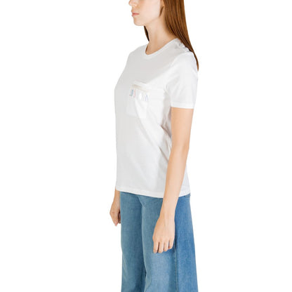 Side view of a woman wearing an Only White Organic Cotton T-Shirt with a chest pocket, paired with blue jeans.