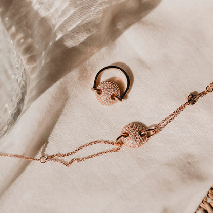 AN JEWELS JEWELRY Mod. AL.BJT01RC rose gold necklace and ring set displayed on elegant fabric surface