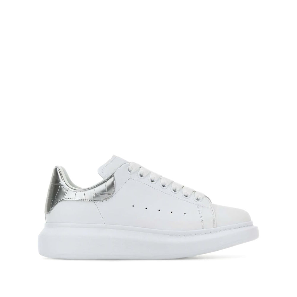 Alexander McQueen Sneakers Silver with white leather, metallic heel, crocodile detailing, lace-up, rubber sole, oversize design.