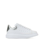 Alexander McQueen Sneakers Silver with white leather, metallic heel, crocodile detailing, lace-up, rubber sole, oversize design.