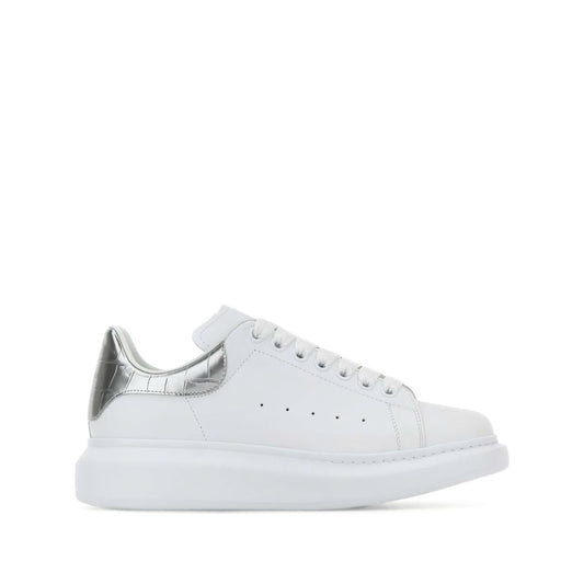 Alexander McQueen Sneakers Silver with white leather, metallic heel, crocodile detailing, lace-up, rubber sole, oversize design.