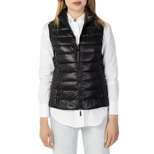 Woman wearing Armani Exchange Black Polyester Sleeveless Jacket with modern style and light, durable polyamide fabric for warmth.